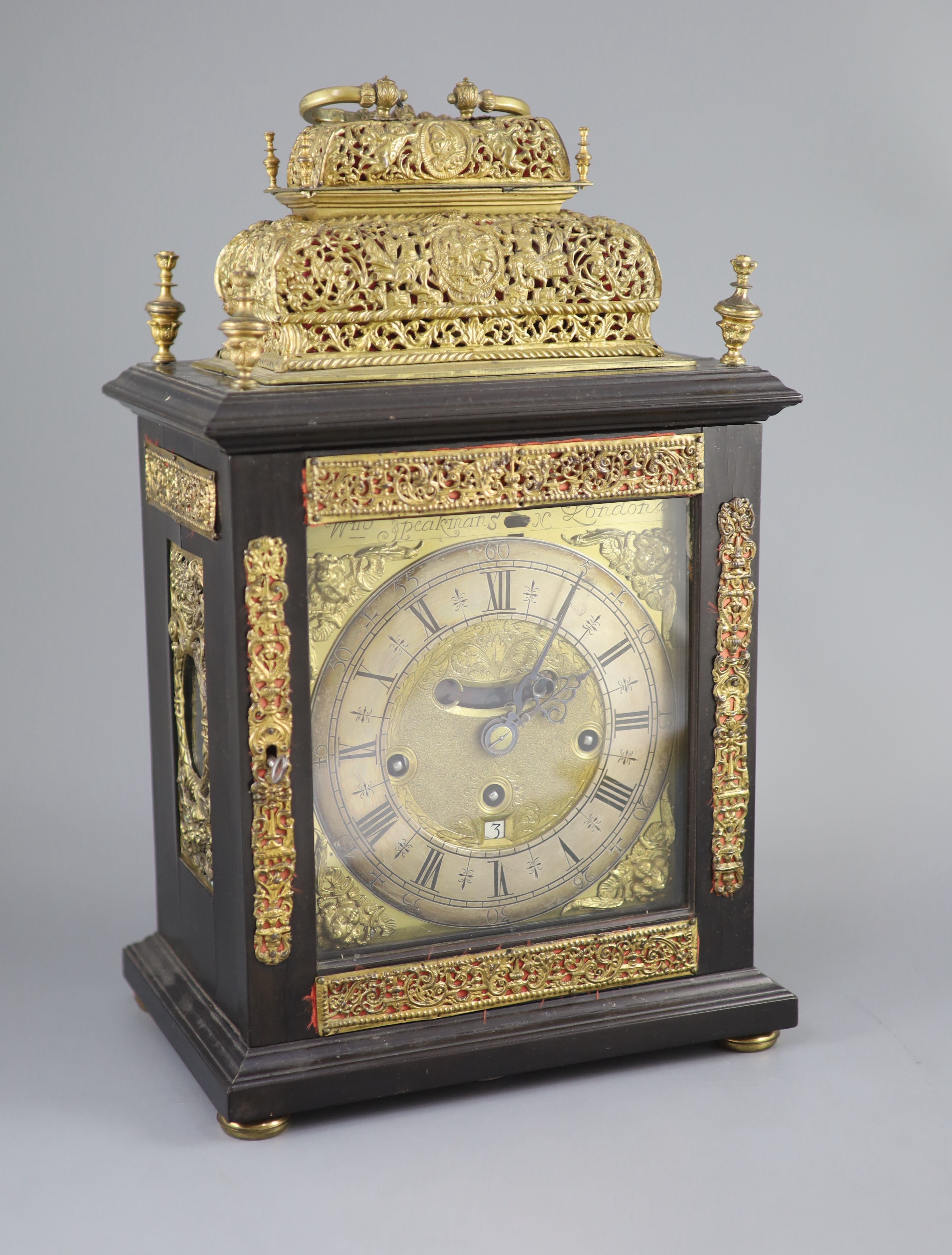 A William III ebonised cased and gilt metal double basket topped chiming and quarter repeating table clock, height 17in.
